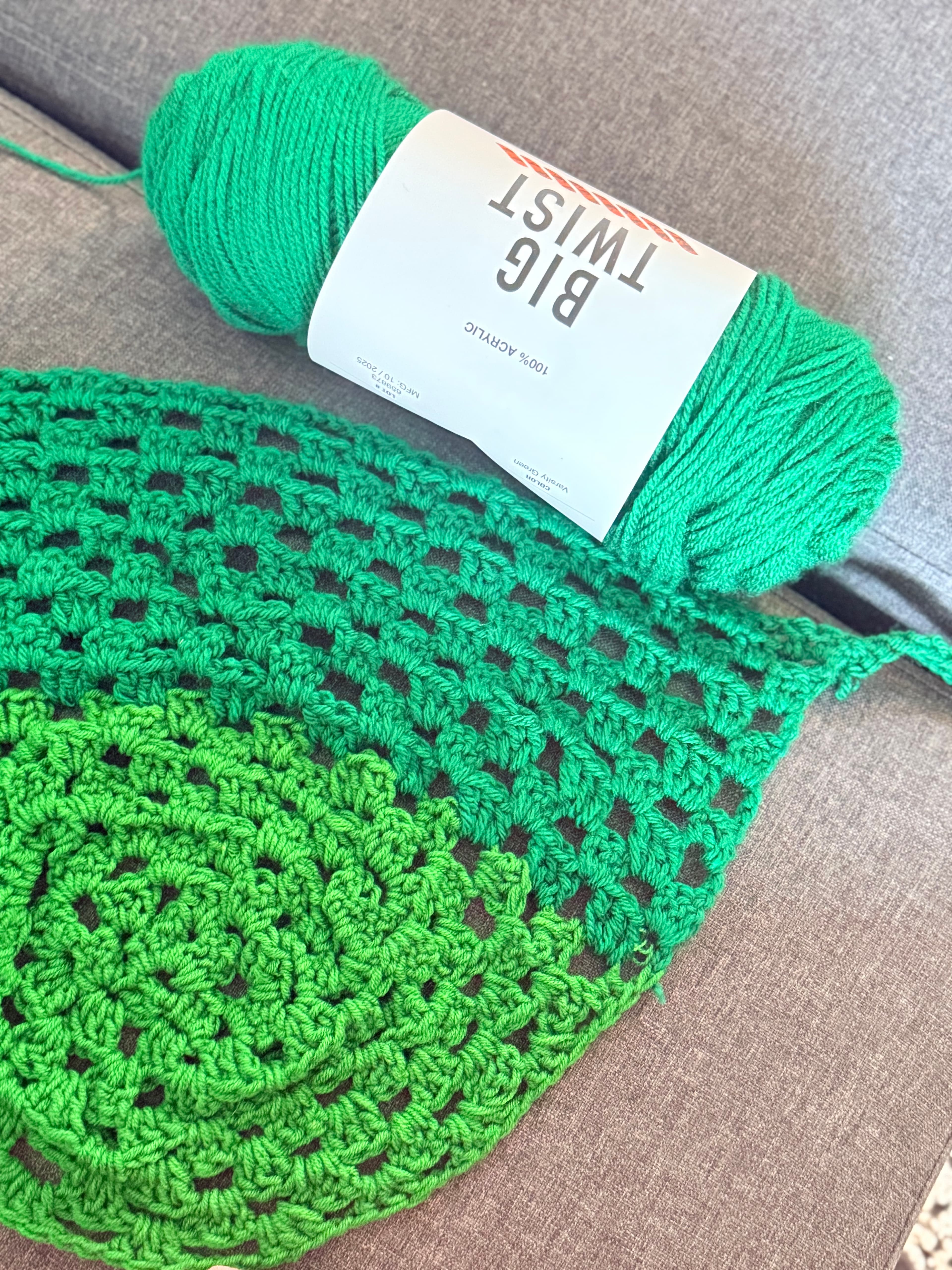 Green crochet bandana with yarn skein